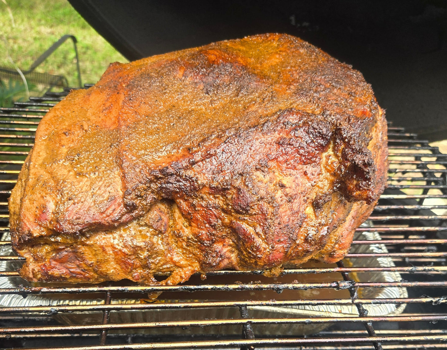Roasted pork shoulder meat on a grill