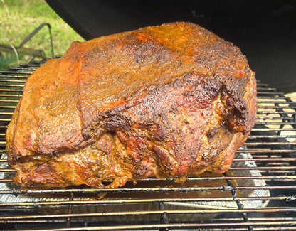 Roasted pork shoulder meat on a grill