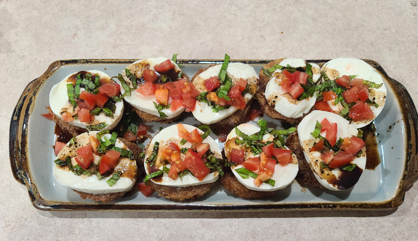 fried green tomato topped with mozzarella marinated tomato