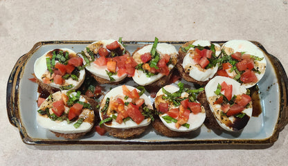 fried green tomato topped with mozzarella marinated tomato